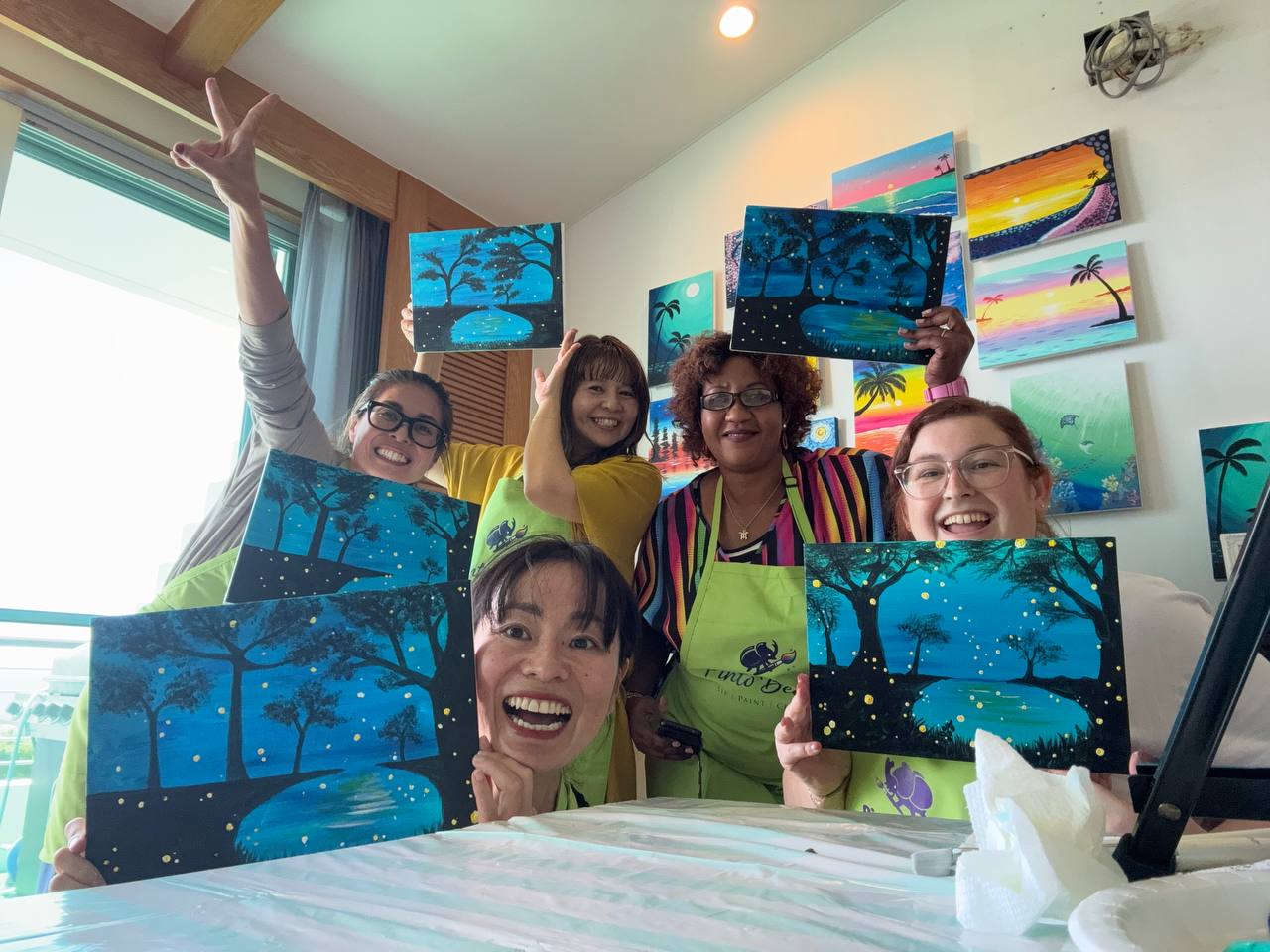 Pinto Beetle guests smiling with finished moonlit paintings