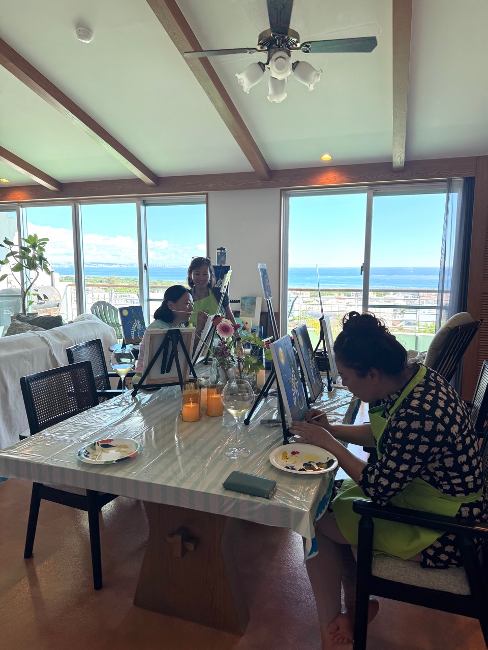 Pinto Beetle guests painting moonlit getto artwork in the ocean-view studio