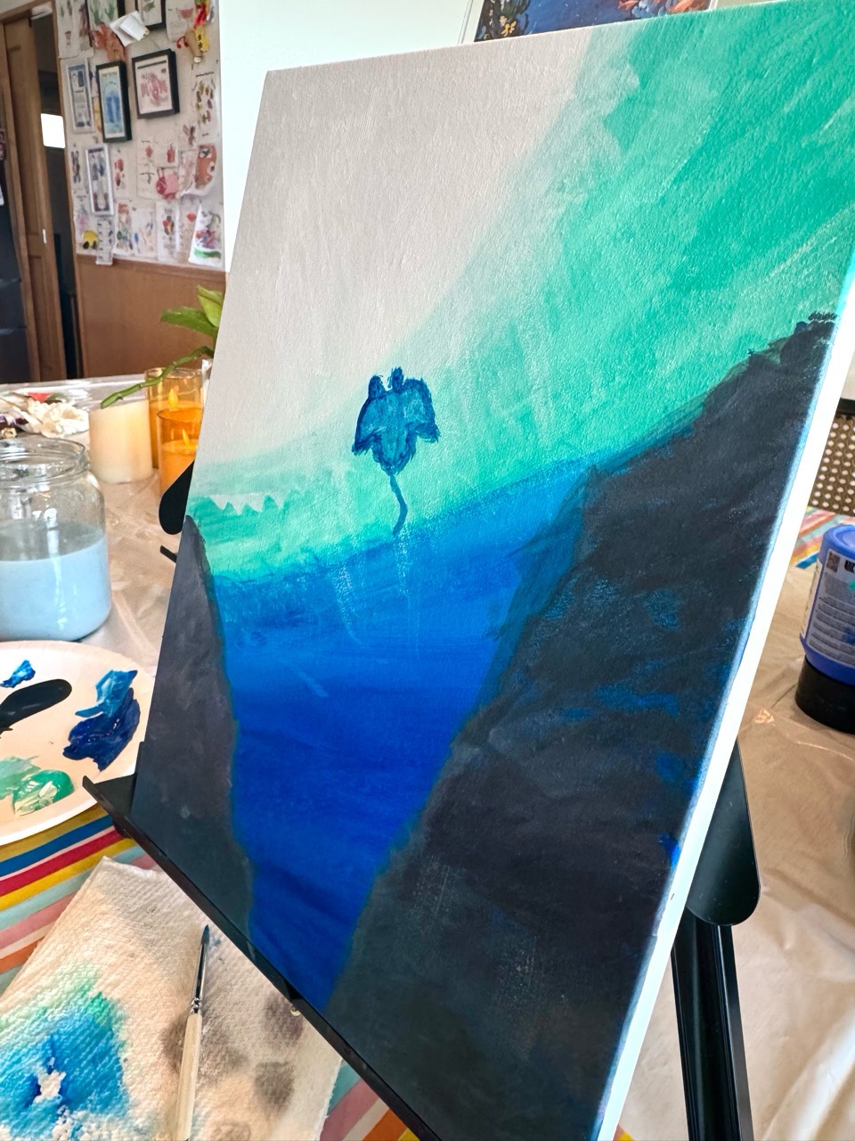 Under the Sea painting in progress on an easel at Pinto Beetle