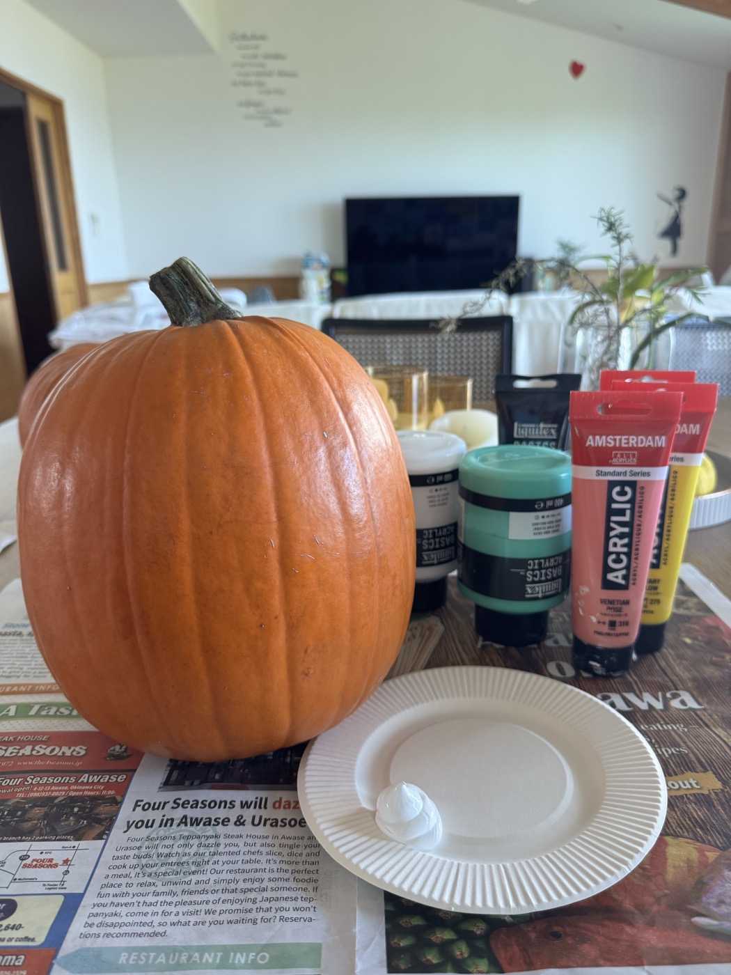 Orange pumpkin with acrylic paints before the painting session