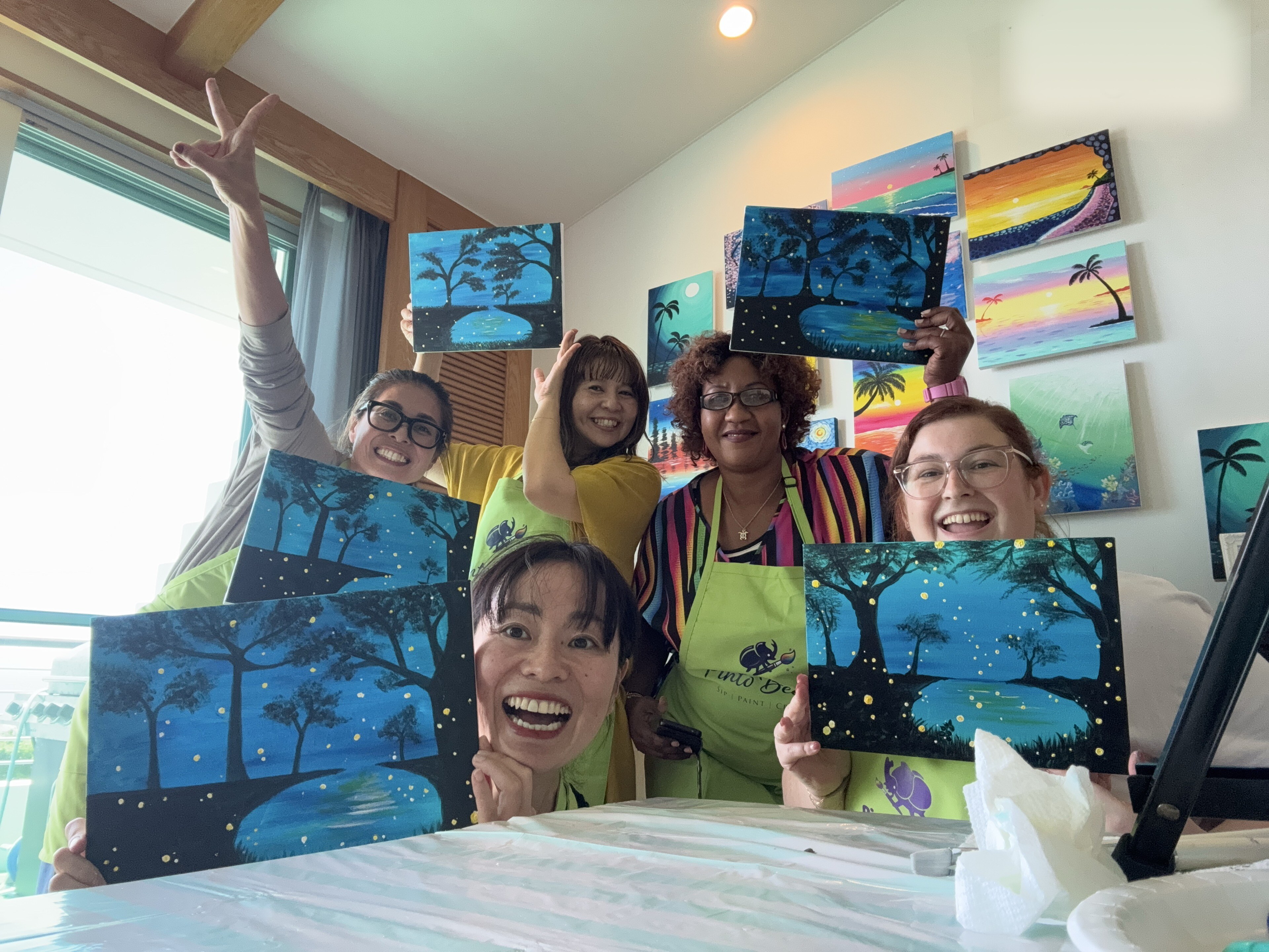 Pinto Beetle guests smiling with finished night paintings